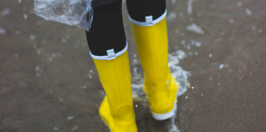 Boots walking in flood